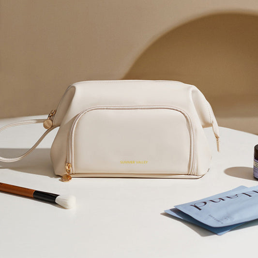 White handbag on a light surface with minimal background